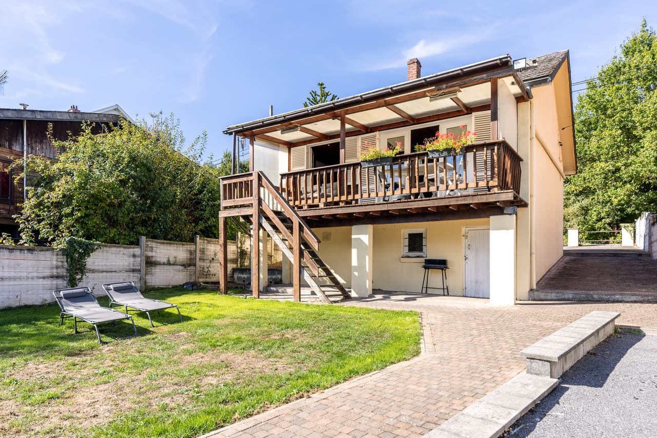 Front of the chalet, balcony, stairs and garden