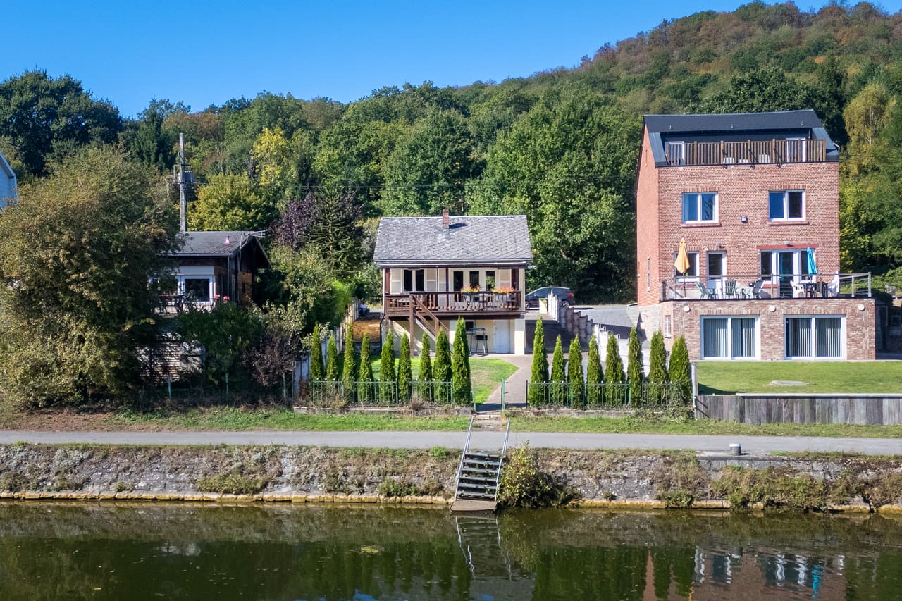 Chalet seen from the river, with the steps down to the water