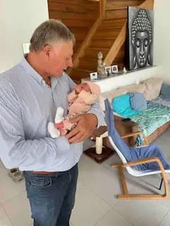 Jean-Claude, your host, holding a baby