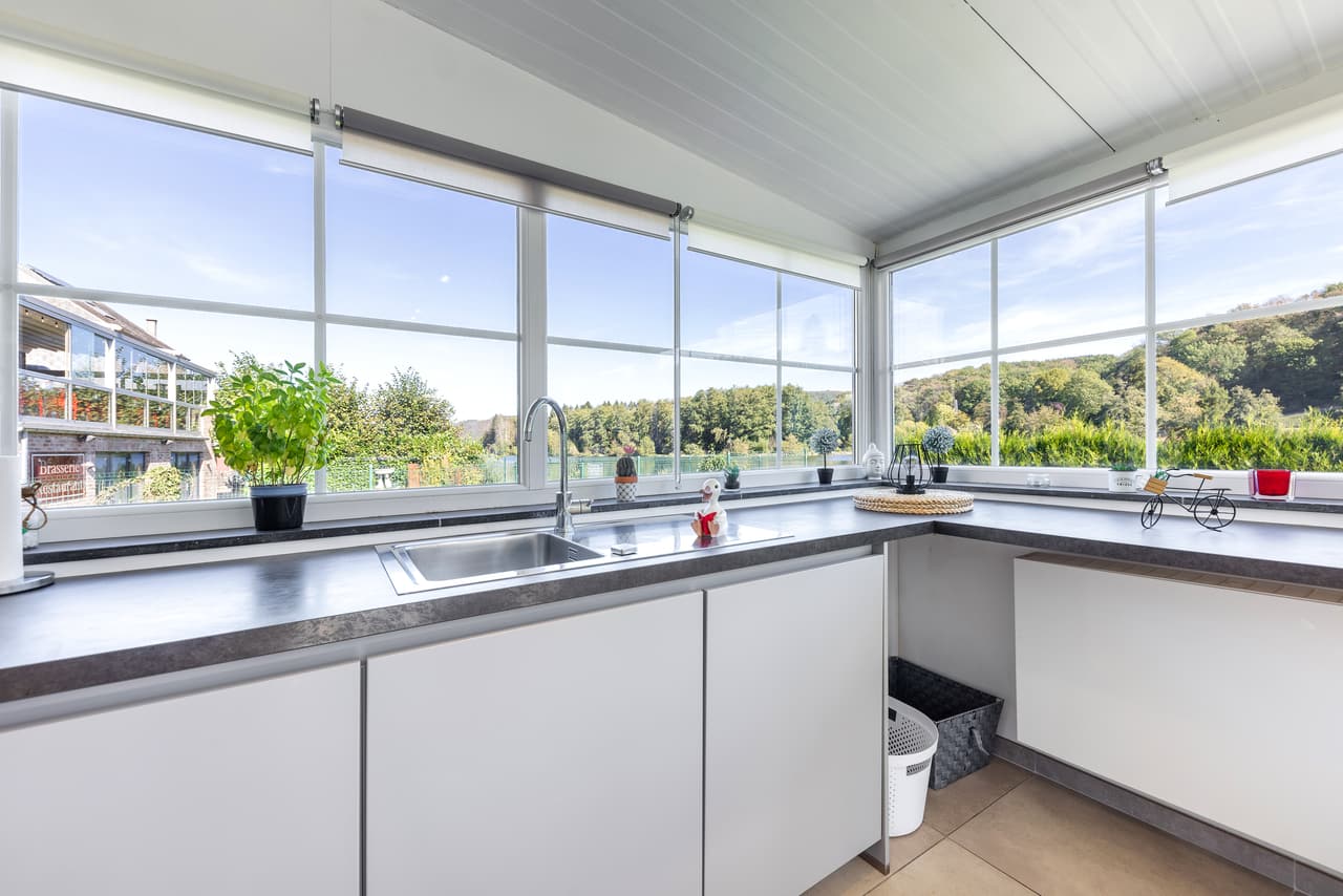 Kitchen sink under the row of windows