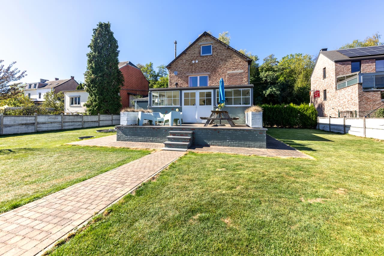 Rear of the house, terrace and lawn