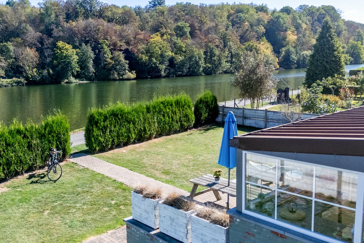 The Meuse at the end of the garden, terrace in the foreground