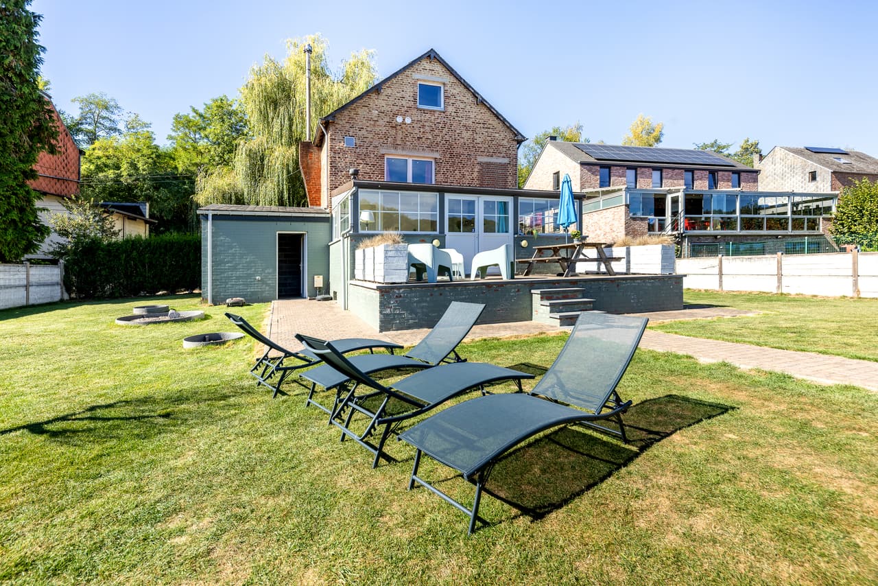 Loungers and the glazed front, seen from the garden