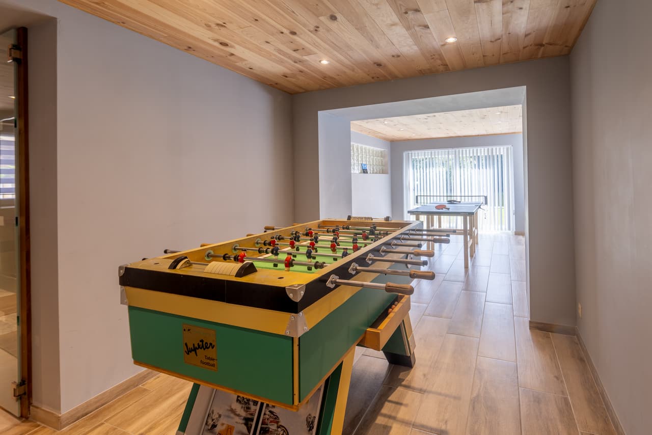 Table football in the games room, with the table-tennis table behind