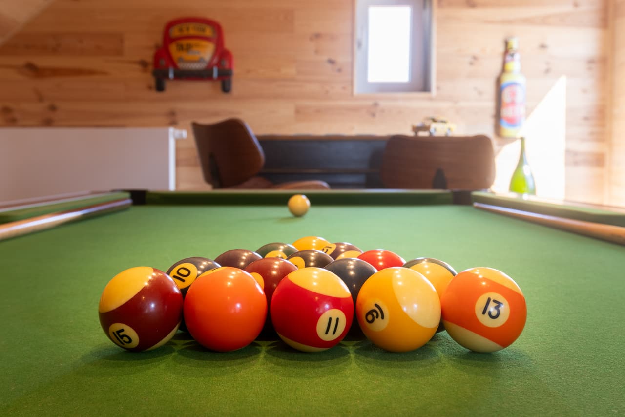 Pool balls racked on the green baize