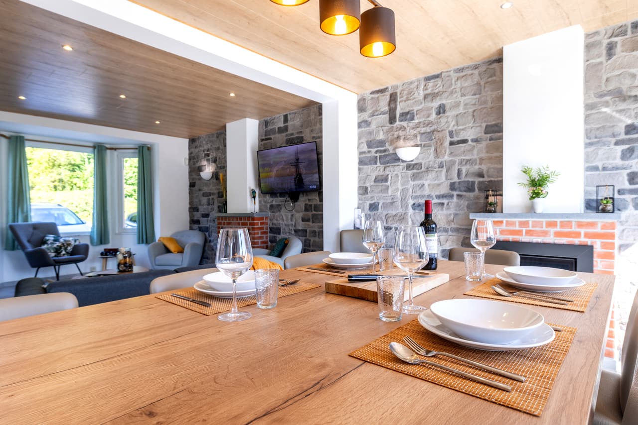 Laid table, with the living room and its fire behind